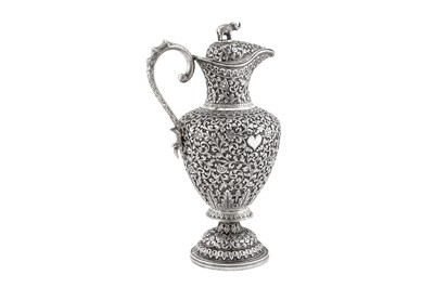 Lot 227 - A late 19th century Anglo – Indian unmarked silver claret jug or ewer, Cutch circa 1870