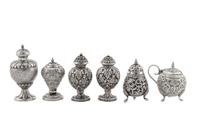 Lot 191 - A pair of late 19th century Anglo – Indian unmarked silver pepper pots, Cutch circa 1890