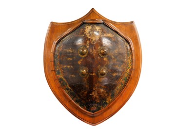 Lot 280 - A POLYCHROME-PAINTED LACQUERED TURTLE SHELL CEREMONIAL SHIELD (DHAL)