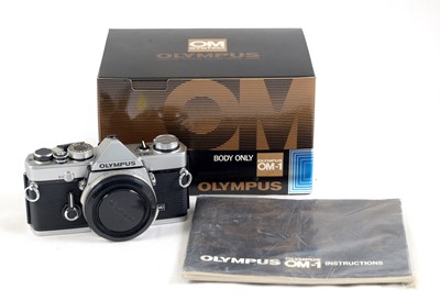 Lot 75 - Three Olympus OM-1 SLR Cameras.