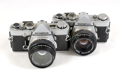 Lot 74 - A Pair of Chrome Olympus OM-1 Cameras.