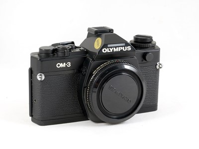 Lot 99 - A Boxed Olympus OM-3 Film Camera.