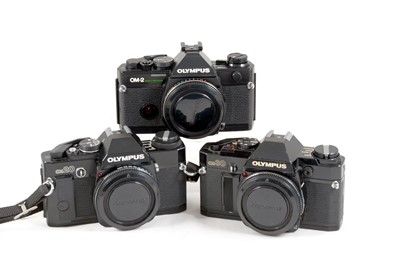 Lot 94 - Three Black Olympus OM Film Cameras Bodies.