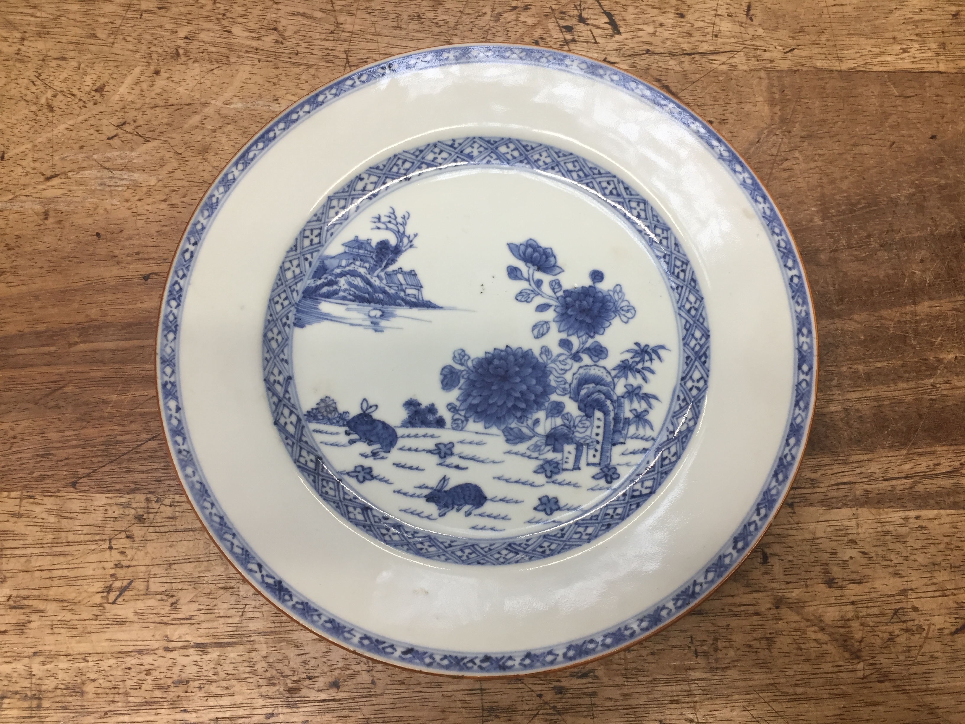 Lot 672 - A CHINESE BLUE AND WHITE 'RABBITS' DISH