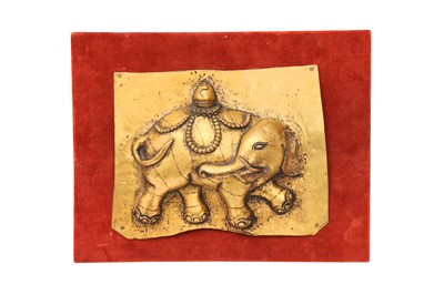 Lot 1090 - A TIBETAN GILT-METAL REPOUSSE 'ELEPHANT' PLAQUE