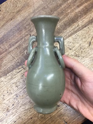 Lot 26 - A CHINESE LONGQUAN CELADON-GLAZED TWIN-HANDLED VASE