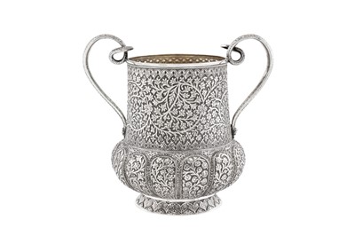 Lot 157 - A late 19th century Anglo – Indian unmarked silver twin handled cup, Kashmir dated 1887
