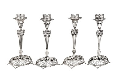 Lot 282 - A set of four mid-19th century Portuguese silver candlesticks, Porto circa 1865 by IM script (unidentified Vidal 1089)