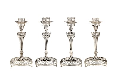 Lot 282 - A set of four mid-19th century Portuguese silver candlesticks, Porto circa 1865 by IM script (unidentified Vidal 1089)