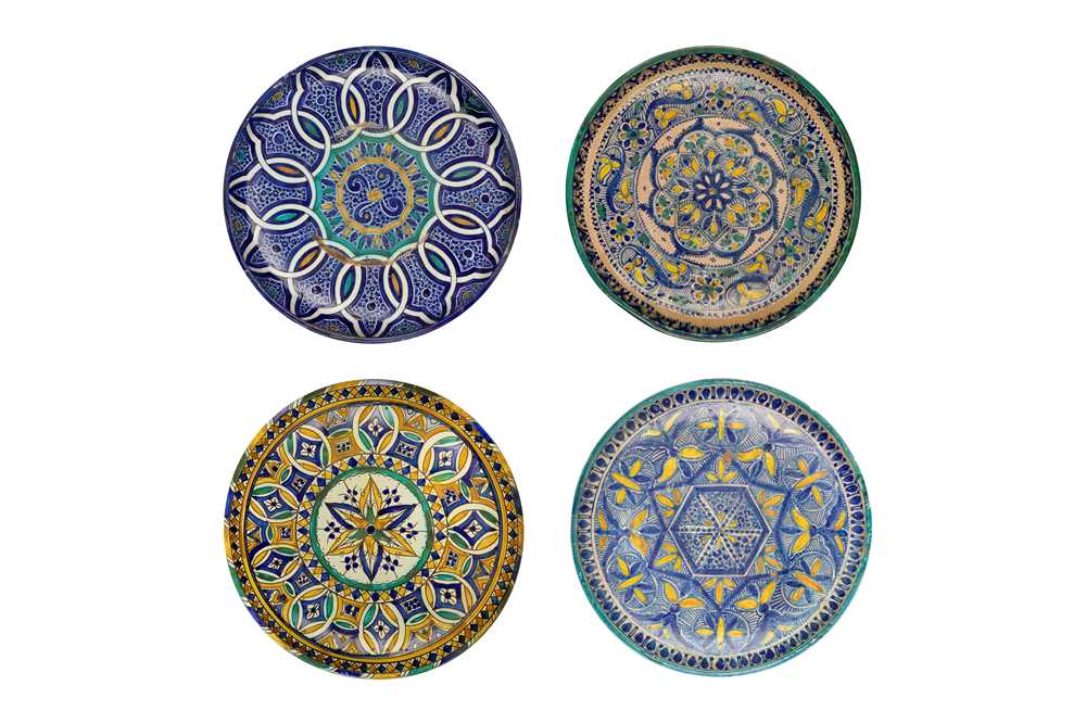 Lot 472 - FOUR MOROCCAN POLYCHROME-PAINTED POTTERY CHARGERS