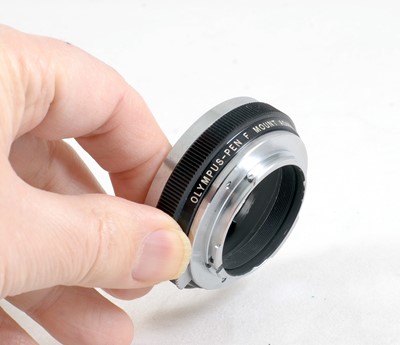 Lot 123 - Olympus Pen F Mount Adapter for Nikon (F) Lenses.