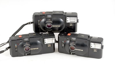Lot 115 - Three Olympus XA Compact Rangefinder Cameras.