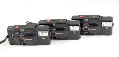 Lot 115 - Three Olympus XA Compact Rangefinder Cameras.