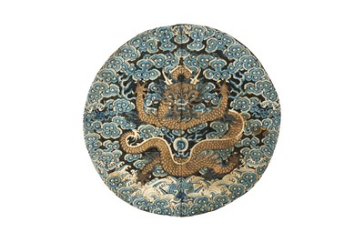 Lot 591 - A CHINESE SILK EMBROIDERED MIDNIGHT-BLUE 'DRAGON' ROUNDEL, BUZI