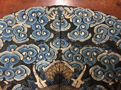 Lot 591 - A CHINESE SILK EMBROIDERED MIDNIGHT-BLUE 'DRAGON' ROUNDEL, BUZI