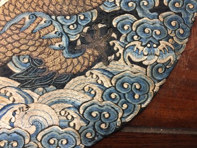 Lot 591 - A CHINESE SILK EMBROIDERED MIDNIGHT-BLUE 'DRAGON' ROUNDEL, BUZI