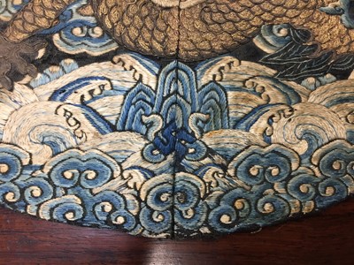 Lot 591 - A CHINESE SILK EMBROIDERED MIDNIGHT-BLUE 'DRAGON' ROUNDEL, BUZI