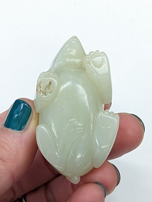 Lot 515 - A CHINESE PALE-CELADON JADE 'BEAR' CARVING
