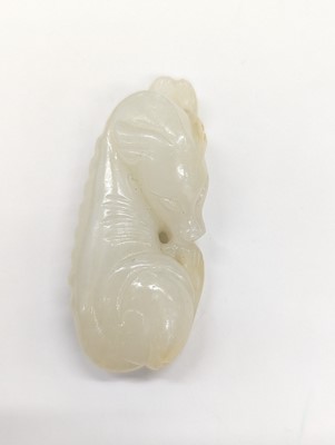 Lot 520 - A CHINESE WHITE JADE 'DOG' CARVING