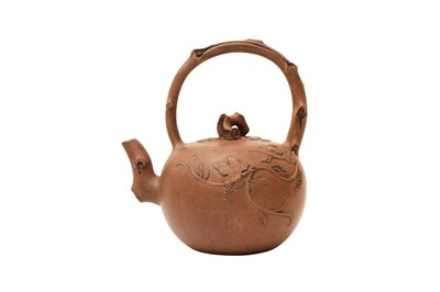 Lot 110 - A CHINESE YIXING ZISHA 'GRAPEVINE' TEAPOT AND COVER