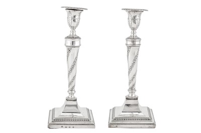 Lot 480 - A pair of George III sterling silver candlesticks, Sheffield 1781/82 by John Winter & Co, retailed by Robert Jones of London