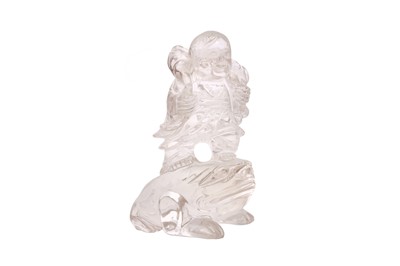 Lot 548 - A CHINESE ROCK CRYSTAL ‘BOY AND TOAD’ CARVING