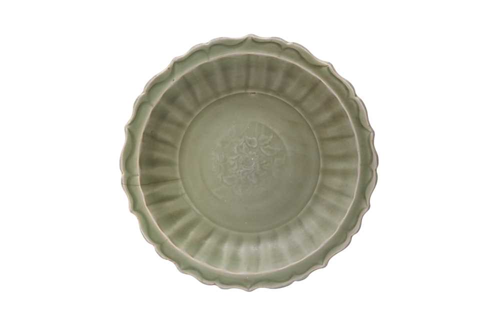 Lot 67 - A CHINESE LONGQUAN CELADON 'PEONY' CHARGER