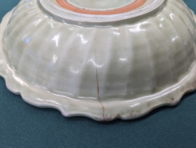 Lot 67 - A CHINESE LONGQUAN CELADON 'PEONY' CHARGER