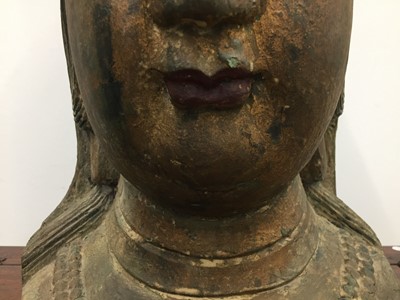 Lot 561 - A CHINESE PAINTED WOOD HEAD OF GUANYIN