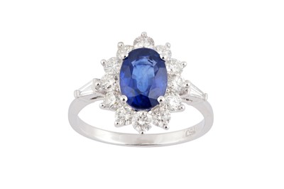 Lot 155 - A sapphire and diamond cluster ring