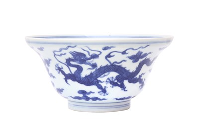 Lot 879 - A CHINESE BLUE AND WHITE 'DRAGON' OGEE BOWL