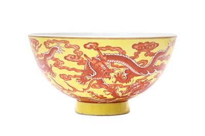 Lot 882 - A CHINESE IRON-RED YELLOW-GROUND 'DRAGON' BOWL