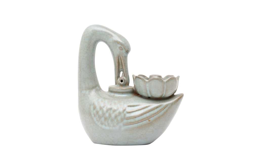 Lot 996 - A CHINESE CELADON-GLAZED 'GOOSE' FIGURE