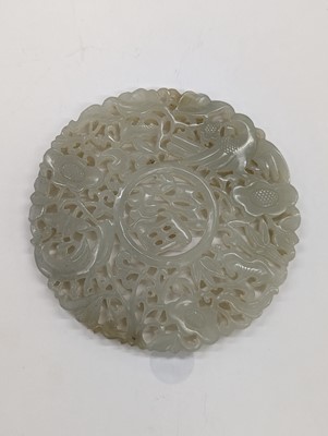 Lot 544 - A CHINESE PALE-CELADON JADE RETICULATED 'FU' PLAQUE