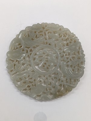 Lot 544 - A CHINESE PALE-CELADON JADE RETICULATED 'FU' PLAQUE