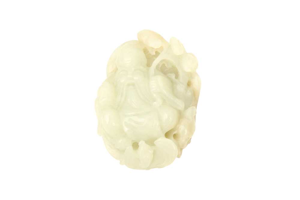 Lot 542 - A CHINESE PALE-CELADON JADE CARVING OF SHOULAO