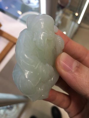 Lot 545 - A CHINESE PALE-CELADON JADE CARVING OF SHOULAO