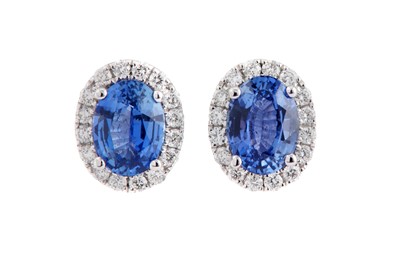 Lot 147 - A pair of sapphire and diamond cluster earstuds