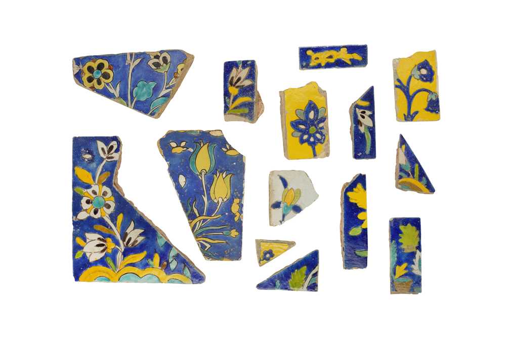 Lot 233 - FOURTEEN FRAGMENTS OF SAFAVID CUERDA SECA POTTERY TILES