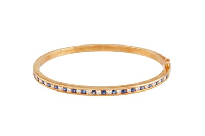 Lot 200 - A sapphire and diamond bangle