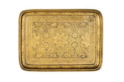 Lot 162 - A QAJAR BRASS TRAY WITH BANQUETING SCENES (BAZM) AND POETRY (SH'ER)