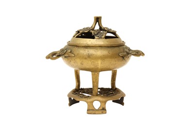 Lot 712 - A CHINESE POLISHED-BRONZE 'PRUNUS' TRIPOD CENSER AND STAND