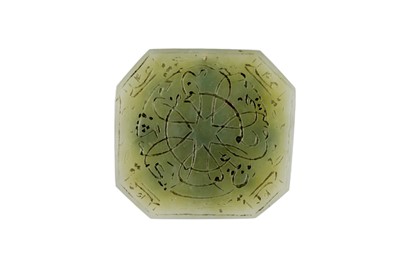 Lot 296 - A KUNDAN-SET NINE-GEM (NAVRATNA) CARVED JADE AMULET