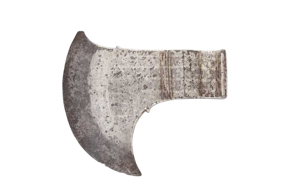 Lot 271 - A PARCEL-GILT SILVER-DAMASCENED STEEL SADDLE-AXE HEAD (TABARZIN)