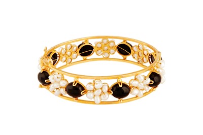 Lot 213 - An onyx and pearl bangle