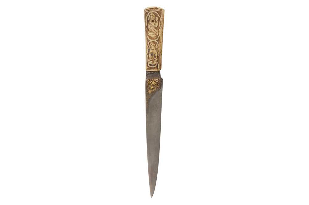 Lot 183 - A QAJAR BONE-HILTED KARD DAGGER