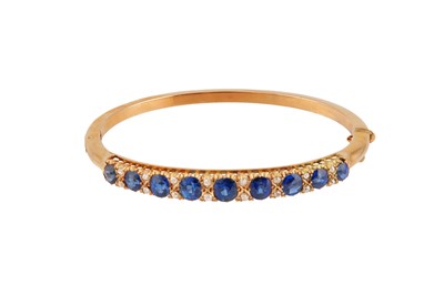 Lot 224 - A sapphire and diamond bangle