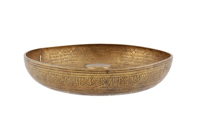 Lot 124 - AN ENGRAVED BRASS 'MAGIC' BOWL WITH PSEUDO-SYRIAC INSCRIPTIONS