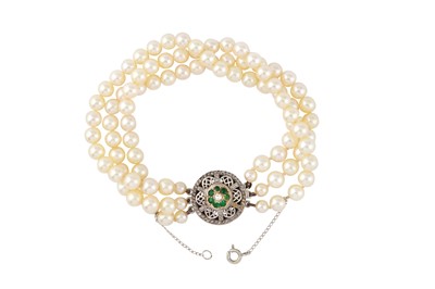 Lot 44 - A multi-strand cultured pearl, emerald and diamond bracelet