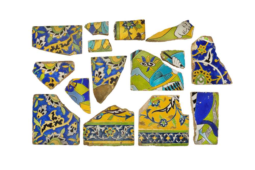 Lot 228 - FIFTEEN FRAGMENTS OF SAFAVID CUERDA SECA POTTERY TILES